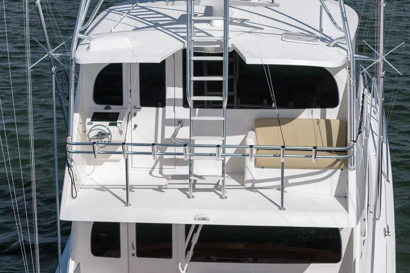 Slide: The Image of 2012 Viking 70 Enclosed Bridge yacht with upper deck and seating area. - 45