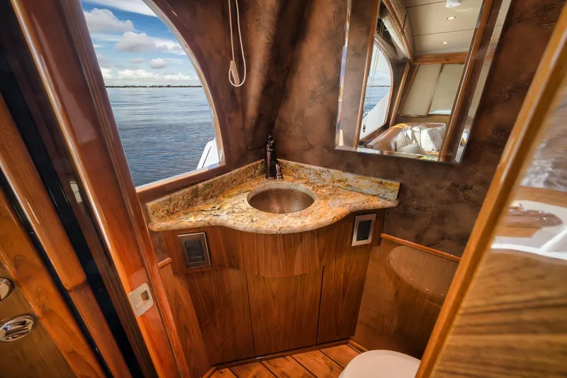 Slide: The Image of Luxurious bathroom on 2012 Viking 70 Enclosed Bridge yacht with ocean view. - 48