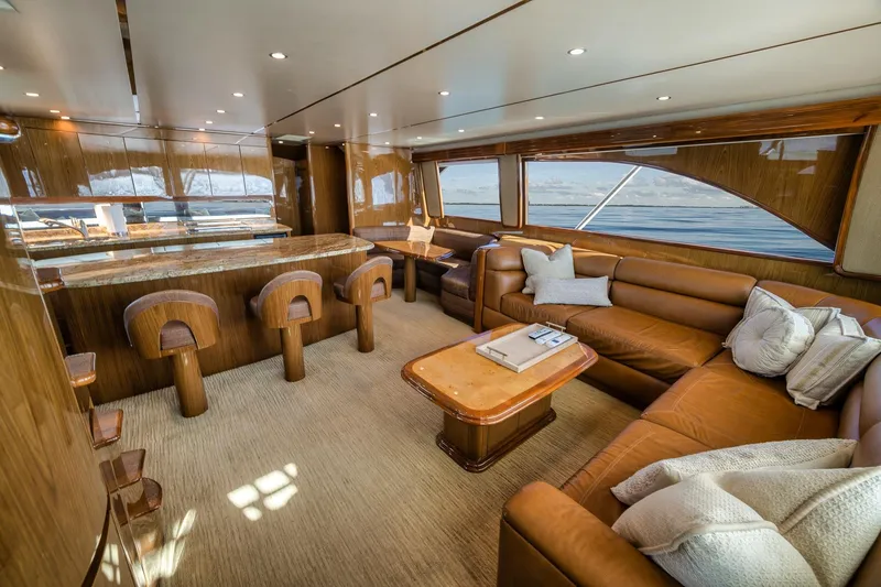 Slide: The Image of Luxurious interior of 2012 Viking 70 Enclosed Bridge yacht with leather seating and wooden finishes. - 50