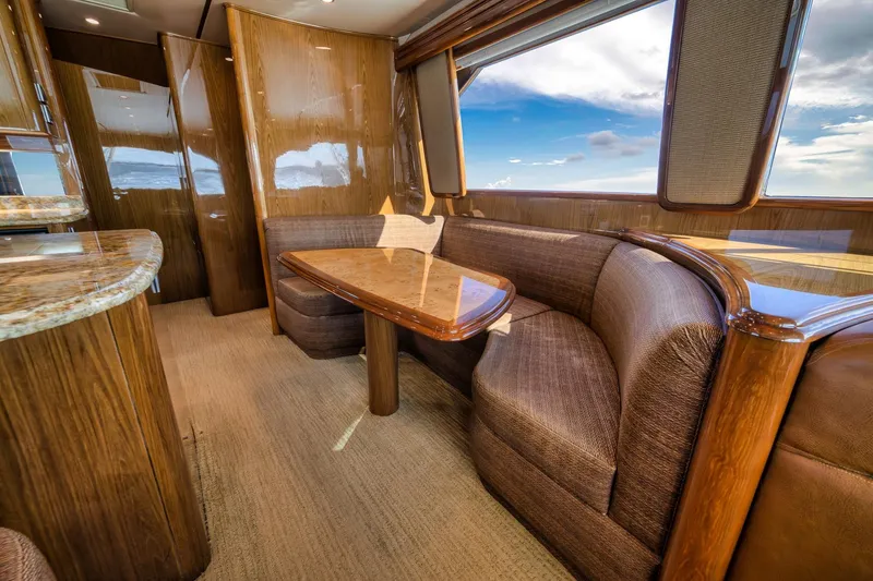 Slide: The Image of Luxurious interior of 2012 Viking 70 Enclosed Bridge yacht with elegant wood finishes. - 54