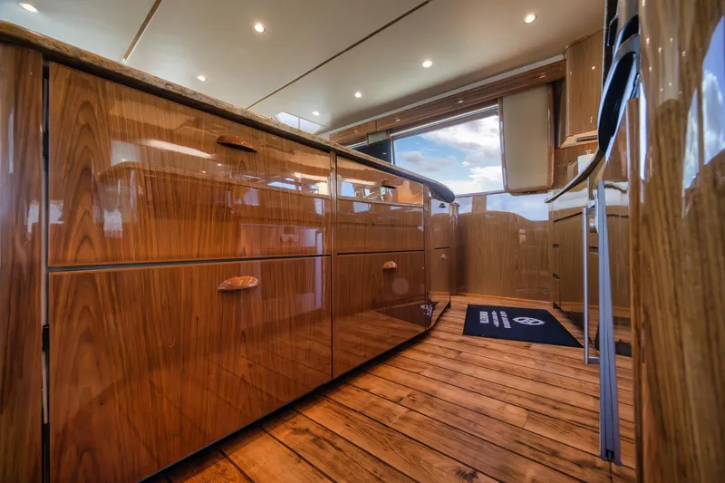 Slide: The Image of Luxurious wooden interior of 2012 Viking 70 Enclosed Bridge yacht kitchen. - 57