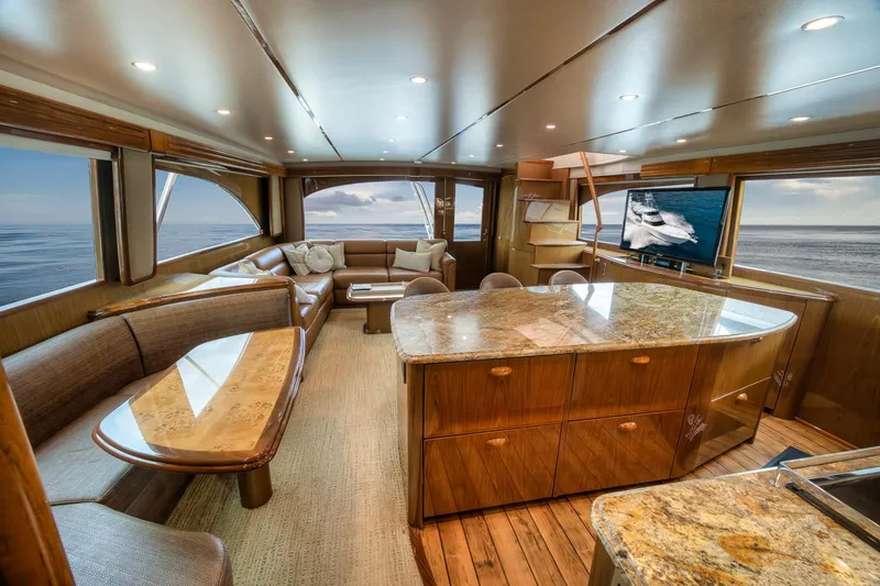 Slide: The Image of Luxurious interior of 2012 Viking 70 Enclosed Bridge yacht with elegant seating and ocean view. - 60