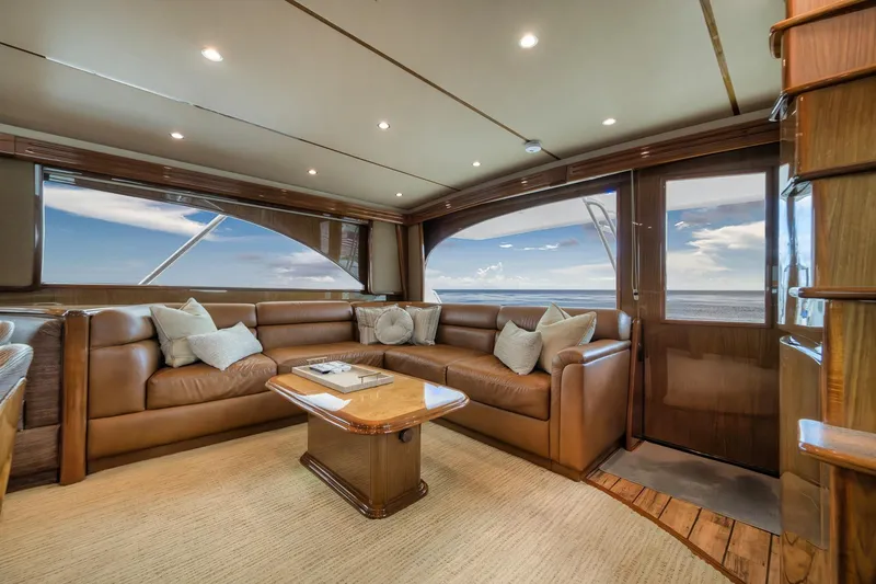 Slide: The Image of Luxurious interior of 2012 Viking 70 Enclosed Bridge yacht with leather seating and ocean view. - 61