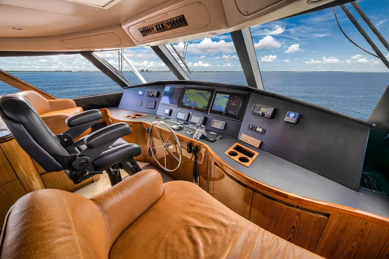 Slide: The Image of Luxurious helm of 2012 Viking 70 Enclosed Bridge yacht with ocean view. - 65