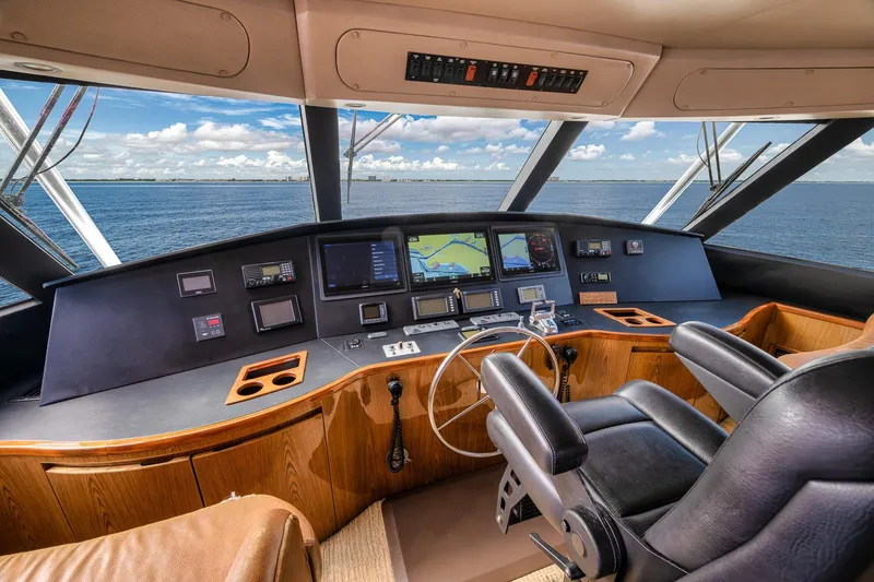 Slide: The Image of Luxurious 2012 Viking 70 Enclosed Bridge yacht helm with ocean view and advanced navigation systems. - 66