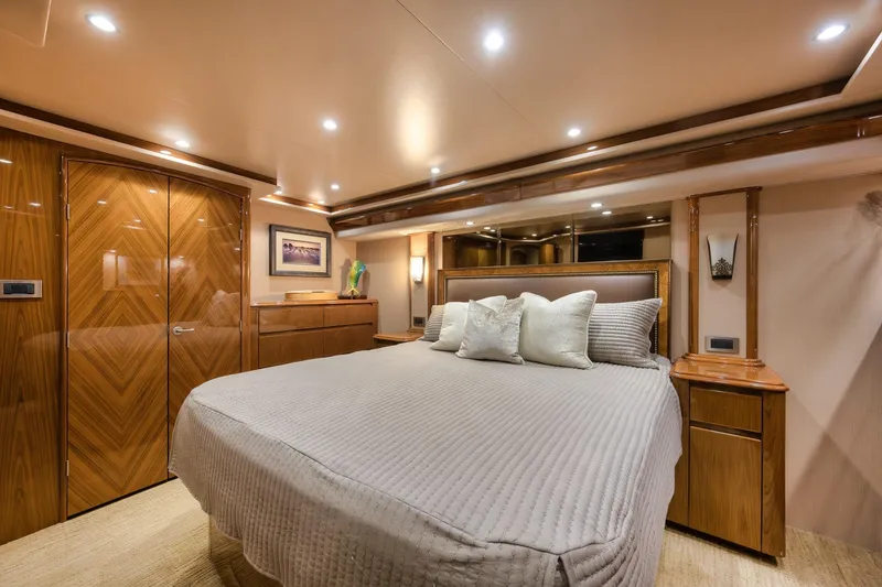 Slide: The Image of Luxurious bedroom interior of 2012 Viking 70 Enclosed Bridge yacht with elegant wood finishes. - 74