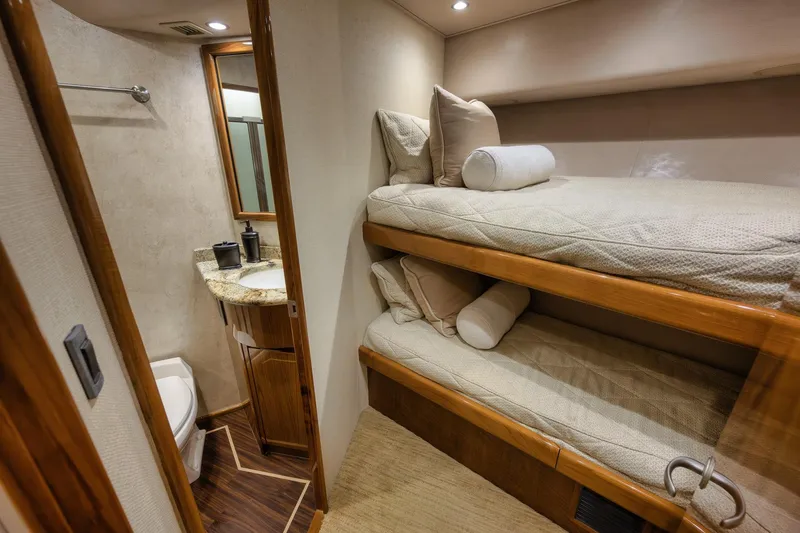 Slide: The Image of Interior of 2012 Viking 70 Enclosed Bridge yacht with bunk beds and bathroom. - 79