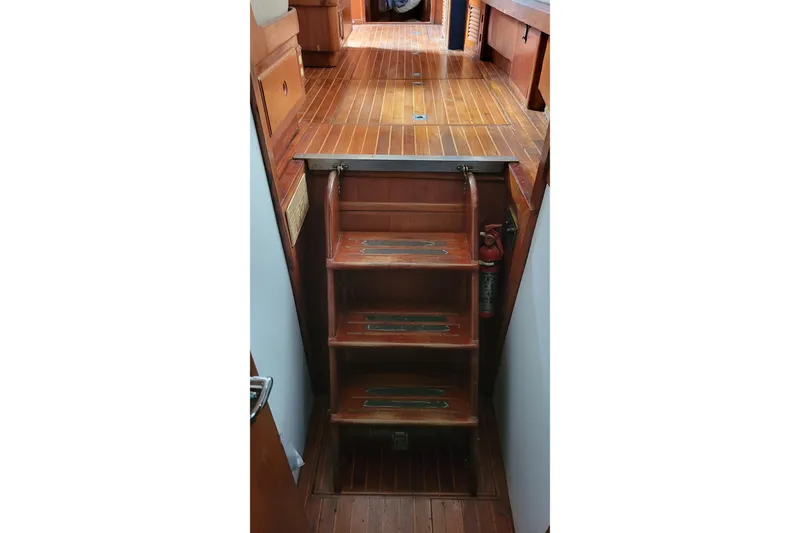 Slide: The Image of 1984 Kha Shing 40 Spindrift yacht deck with seating, docked at marina. - 12