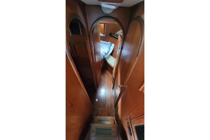 Slide: The Image of 1984 Kha Shing 40 Spindrift yacht interior with wooden helm and navigation equipment. - 17