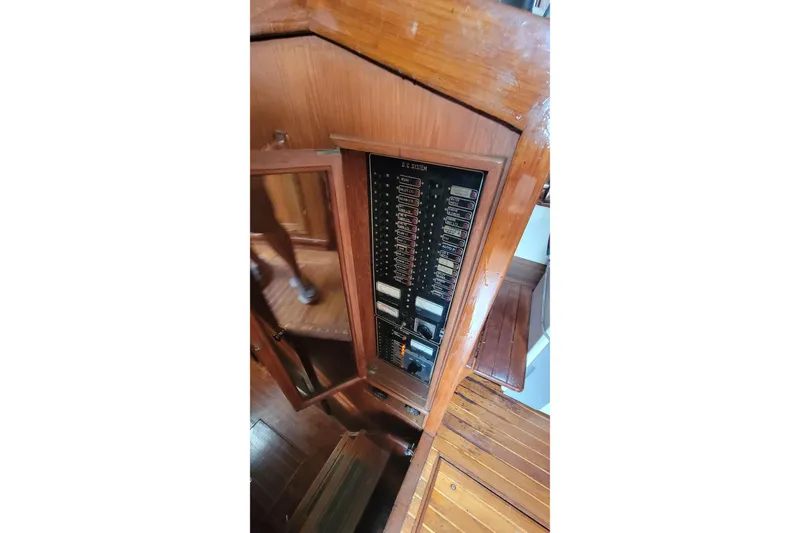 Slide: The Image of 1984 Kha Shing 40 Spindrift yacht interior with wooden helm and cabin entrance. - 20