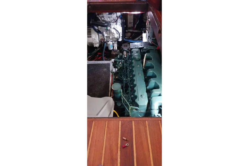 Slide: The Image of 1984 Kha Shing 40 Spindrift yacht interior with wooden cabinetry and porthole window. - 23