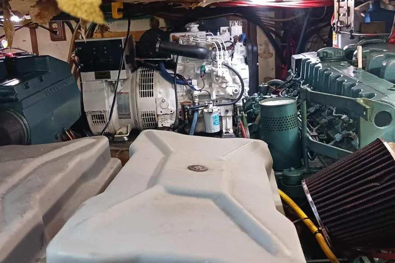 Slide: The Image of Control panel inside 1984 Kha Shing 40 Spindrift yacht, featuring wooden interior and electronic device. - 26