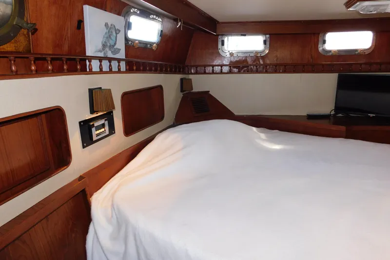 Slide: The Image of Cozy cabin interior of 1984 Kha Shing 40 Spindrift yacht with wooden accents. - 32