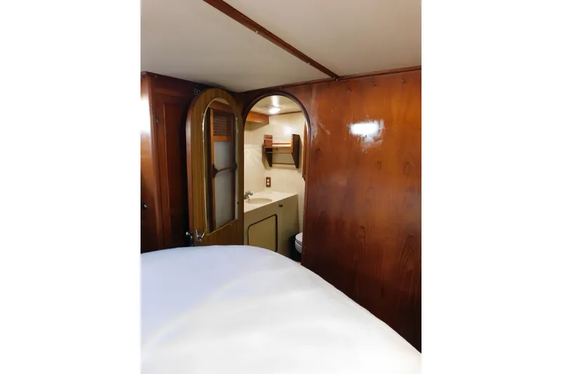 Slide: The Image of Interior of 1984 Kha Shing 40 Spindrift yacht with wooden paneling and compact bathroom. - 35
