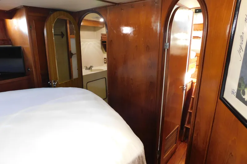 Slide: The Image of Interior of 1984 Kha Shing 40 Spindrift yacht with wood paneling and cozy cabin. - 37