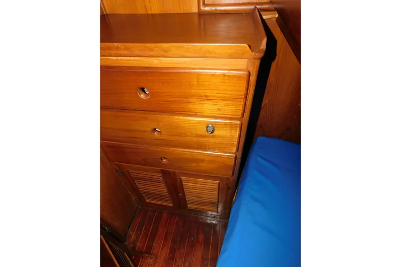 Slide: The Image of Wooden interior of 1984 Kha Shing 40 Spindrift yacht with drawers and blue cushion. - 43