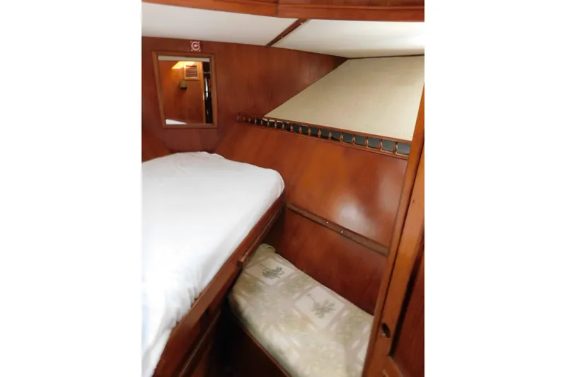 Slide: The Image of Cozy cabin interior of 1984 Kha Shing 40 Spindrift yacht with wooden paneling. - 49