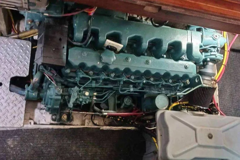 Slide: The Image of Engine compartment of a 1984 Kha Shing 40 Spindrift yacht, showcasing mechanical components. - 50