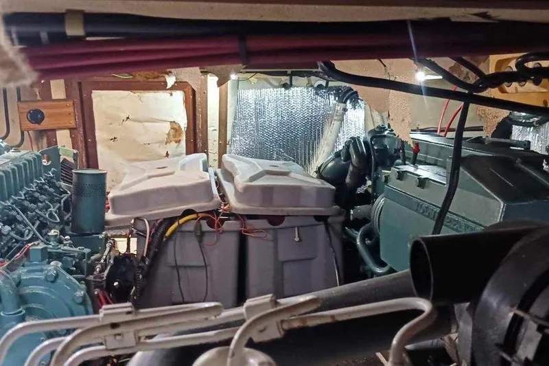 Slide: The Image of Engine room of 1984 Kha Shing 40 Spindrift yacht, showcasing mechanical components and wiring. - 51