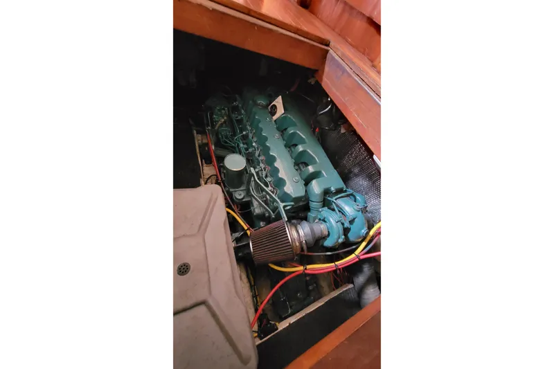 Slide: The Image of Engine compartment of a 1984 Kha Shing 40 Spindrift yacht, showcasing mechanical components. - 58