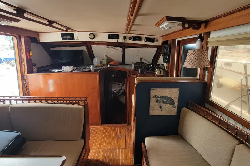 Slide: The Image of 1984 Kha Shing 40 Spindrift yacht deck with hatch and railing in a marina. - 6