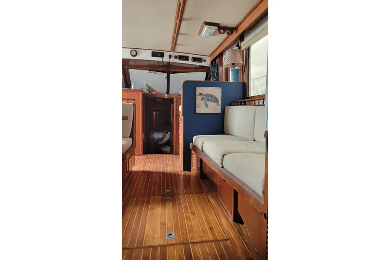 Slide: The Image of Inflatable dinghy beside 1984 Kha Shing 40 Spindrift yacht on dry dock. - 9