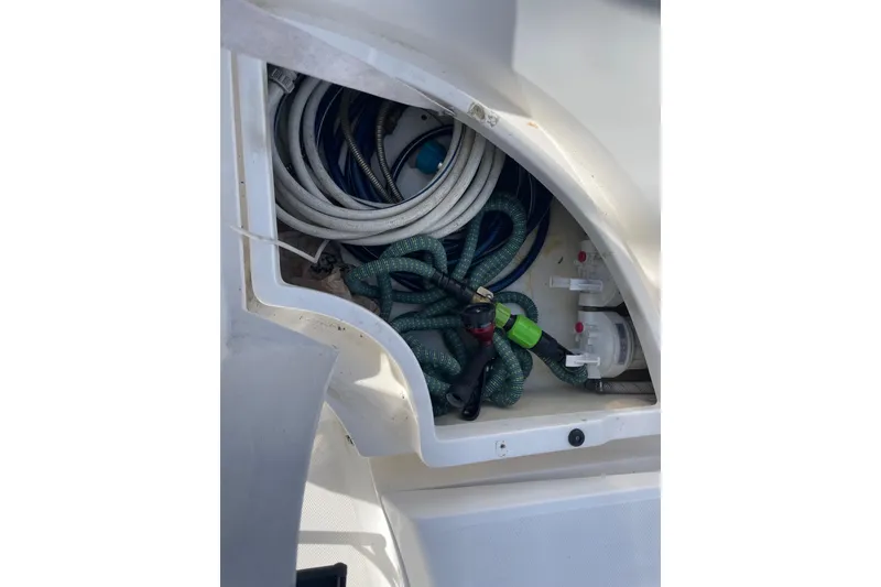 Slide: The Image of Raymarine display on 1999 Hunter 460 yacht, featuring navigation controls and menu buttons. - 12