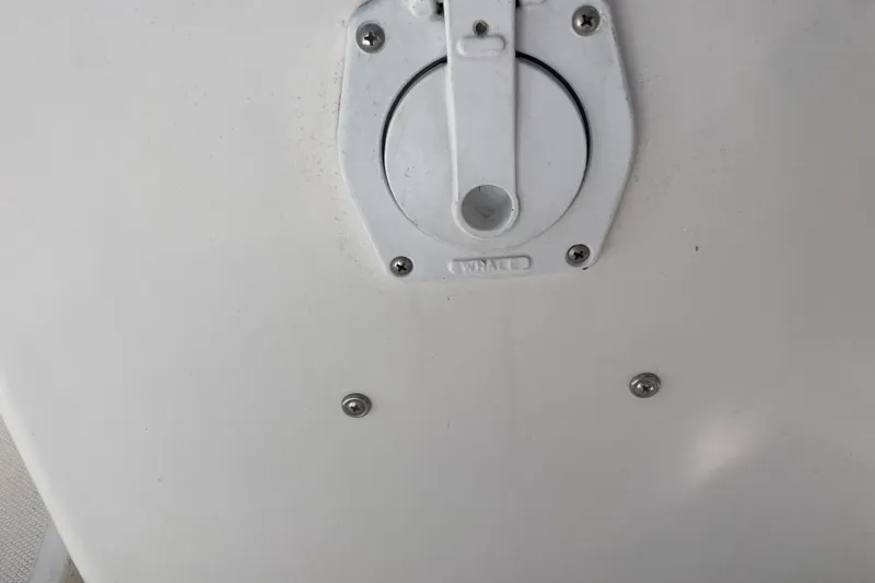 Slide: The Image of Open storage compartment on a 1999 Hunter 460 boat, showing interior contents. - 15