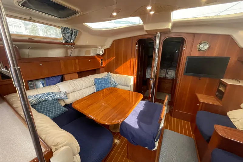 Slide: The Image of Interior view of 1999 Hunter 460 sailboat, showing cabin and galley area. - 23