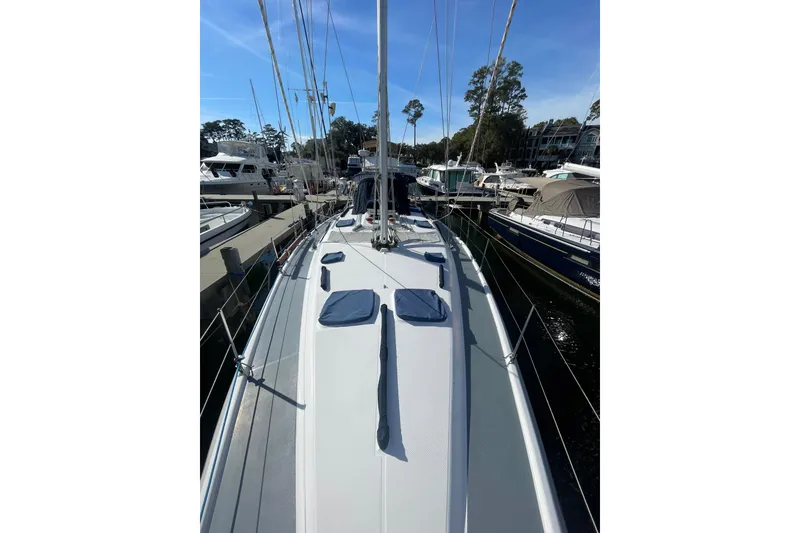 Slide: The Image of Sailing on a 1999 Hunter 460 yacht at sunset over calm waters. - 3