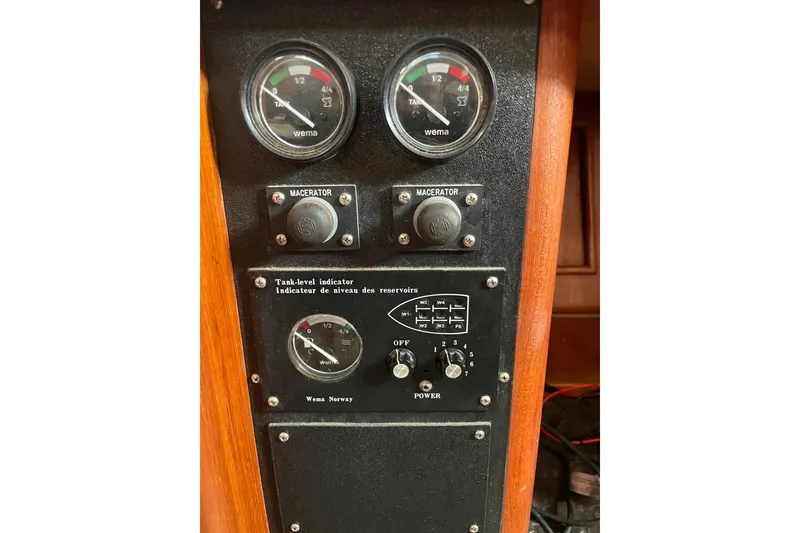 Slide: The Image of Double sink in 1999 Hunter 460 yacht kitchen with wooden cabinetry. - 32