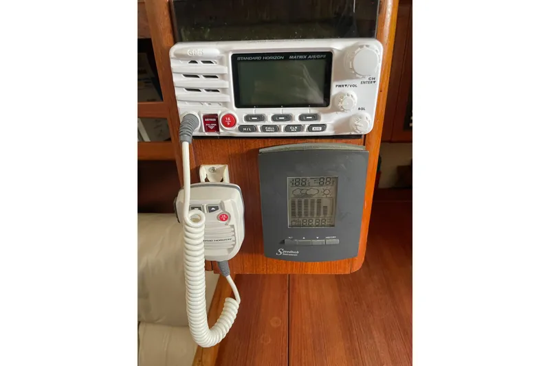 Slide: The Image of Interior of a 1999 Hunter 460 sailboat with navigation station and control panel. - 34