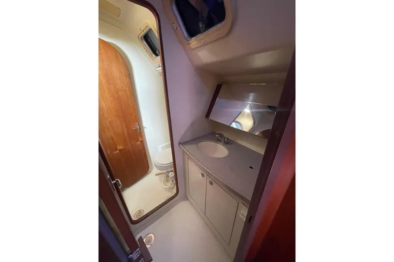 Slide: The Image of Control panel of a 1999 Hunter 460 boat with battery and bilge pump switches. - 38