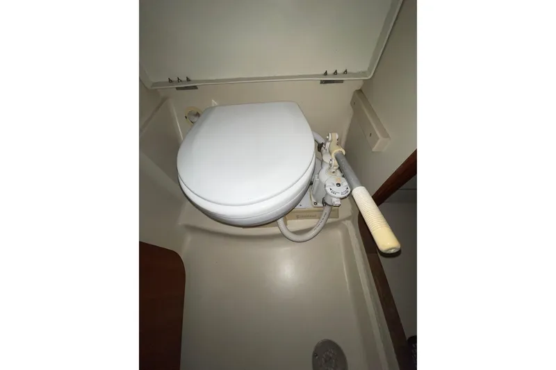 Slide: The Image of Marine toilet in a 1999 Hunter 460 sailboat bathroom. - 49
