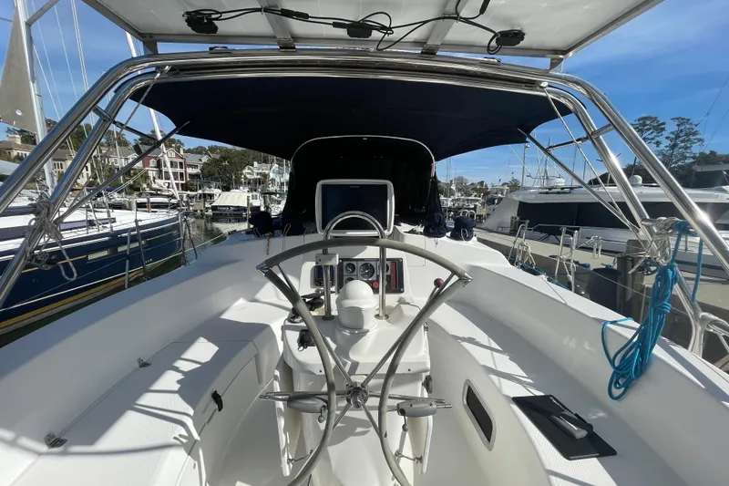 Slide: The Image of Sailboat docked at marina, Hunter 460 model, 1999, surrounded by other boats. - 5