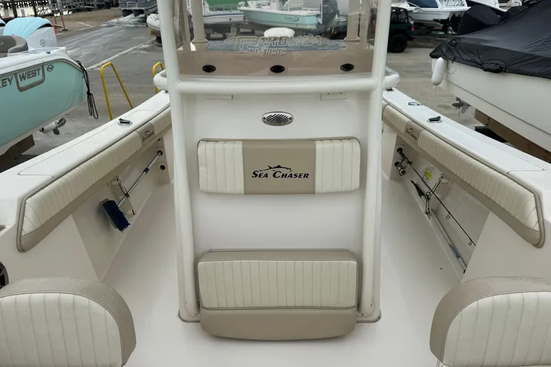Slide: The Image of 2019 Sea Chaser 24 HFC boat interior with seating and storage compartments. - 15
