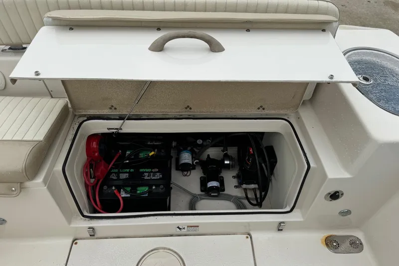 Slide: The Image of 2019 Sea Chaser 24 HFC boat battery compartment with wiring and components. - 3