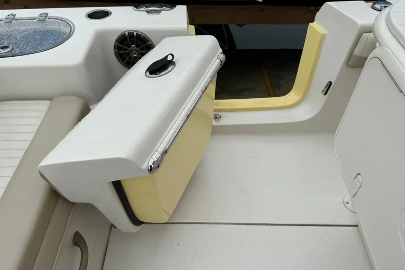 Slide: The Image of 2019 Sea Chaser 24 HFC boat interior with seating and storage compartments. - 6