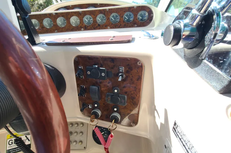 Slide: The Image of 1996 Regal Commodore 292 dashboard with wood accents and control panel. - 21