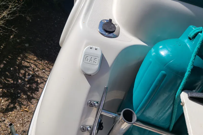 Slide: The Image of Gas cap and fender on 1996 Regal Commodore 292 boat deck. - 34