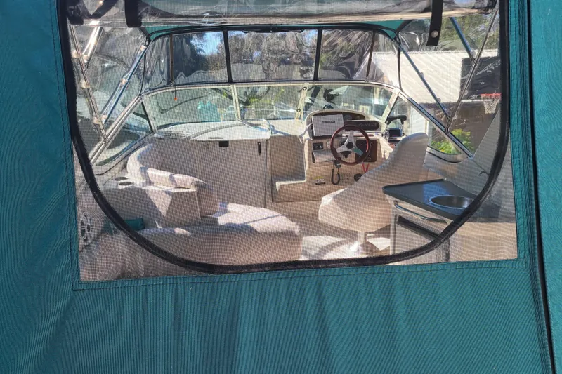 Slide: The Image of Interior view of a 1996 Regal Commodore 292 boat through a clear window. - 35