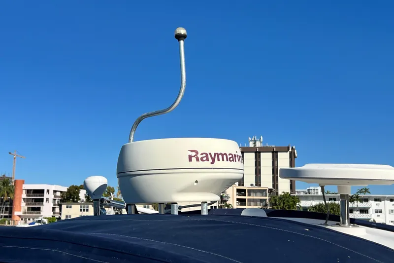 Slide: The Image of Radar equipment on 2006 Four Winns 348 Vista boat against clear blue sky. - 104
