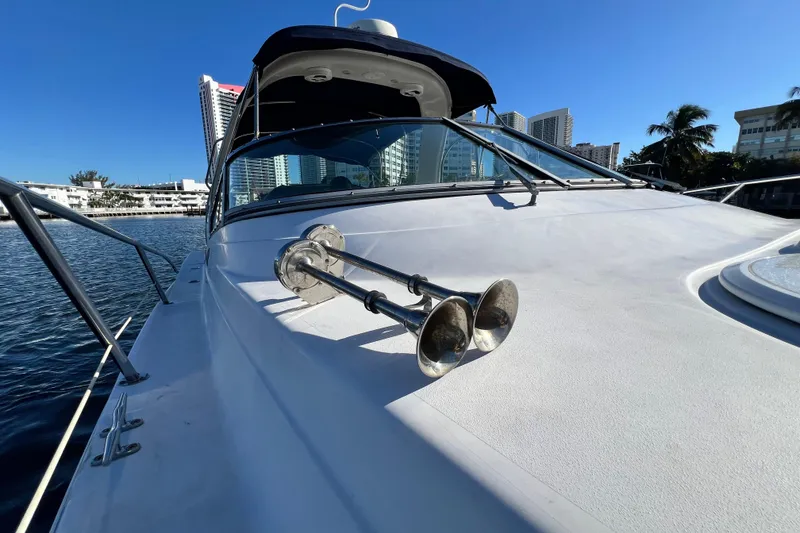 Slide: The Image of 2006 Four Winns 348 Vista yacht with city skyline in background. - 106