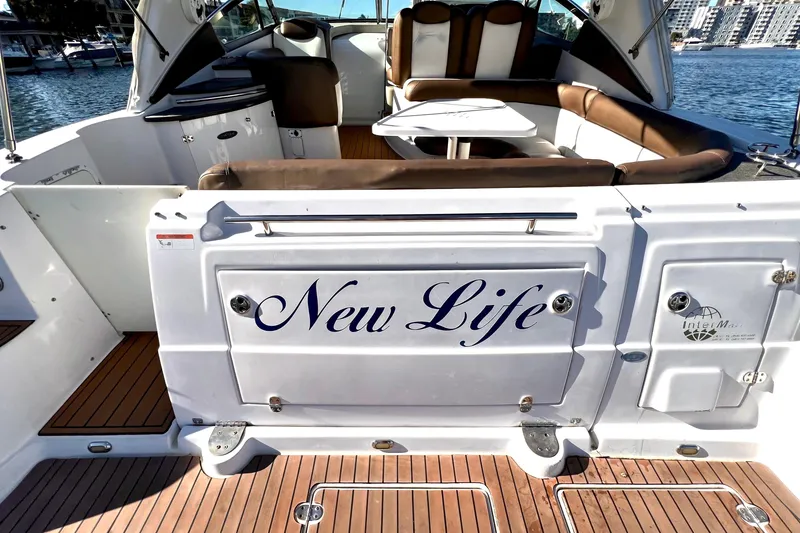 Slide: The Image of 2006 Four Winns 348 Vista boat interior with "New Life" name, docked at marina. - 113