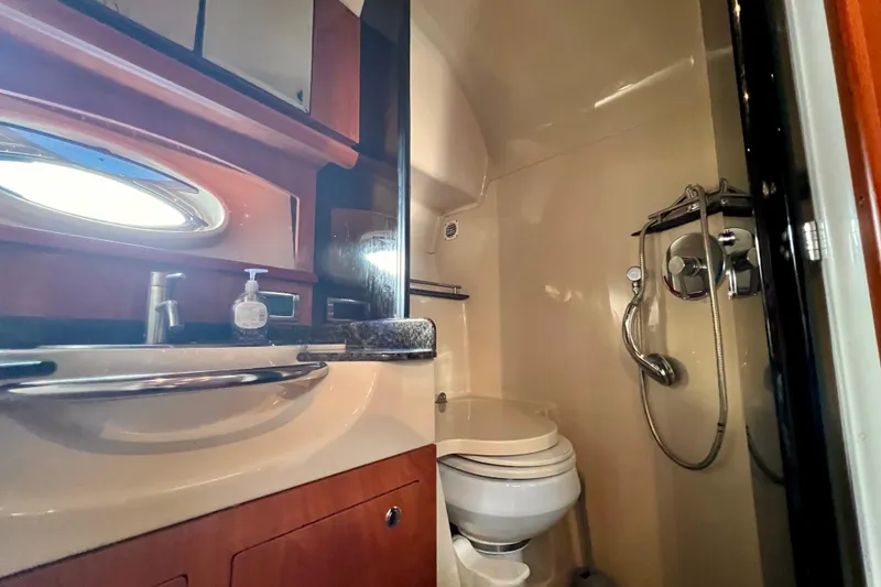 Slide: The Image of 2006 Four Winns 348 Vista yacht bathroom with sink, toilet, and shower. - 25