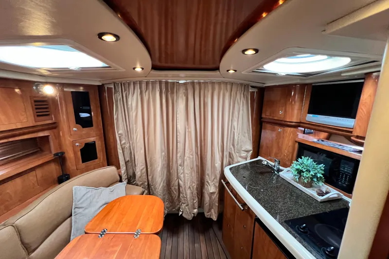 Slide: The Image of Interior of 2006 Four Winns 348 Vista yacht with wood finish and modern amenities. - 26