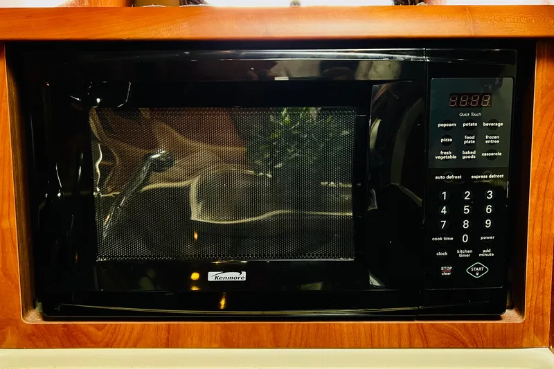 Slide: The Image of Built-in Kenmore microwave in 2006 Four Winns 348 Vista boat kitchen. - 36