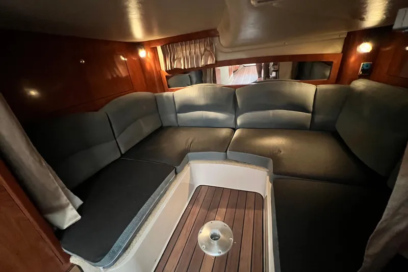 Slide: The Image of 2006 Four Winns 348 Vista interior with cozy seating and wooden accents. - 39