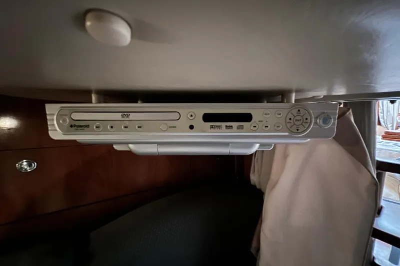 Slide: The Image of DVD player in 2006 Four Winns 348 Vista boat interior, mounted under a cabinet. - 41