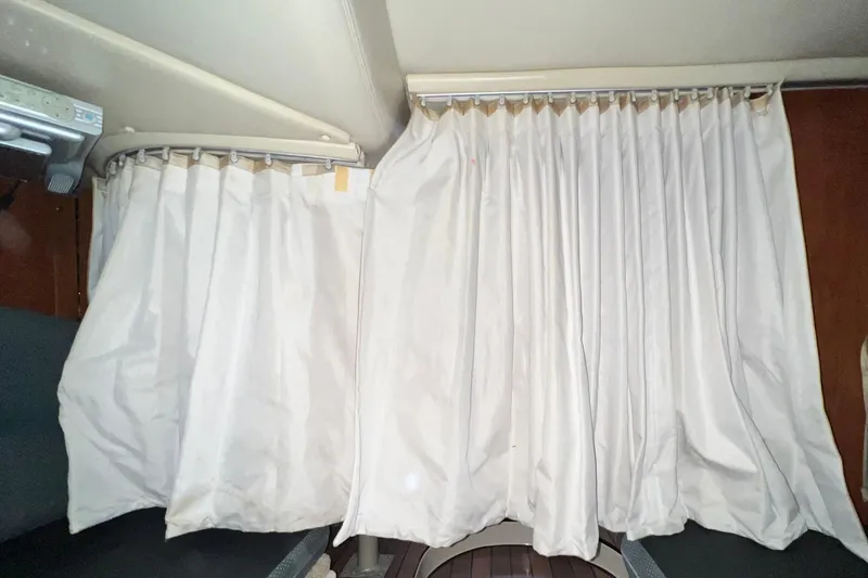 Slide: The Image of Interior curtains of a 2006 Four Winns 348 Vista boat cabin. - 44